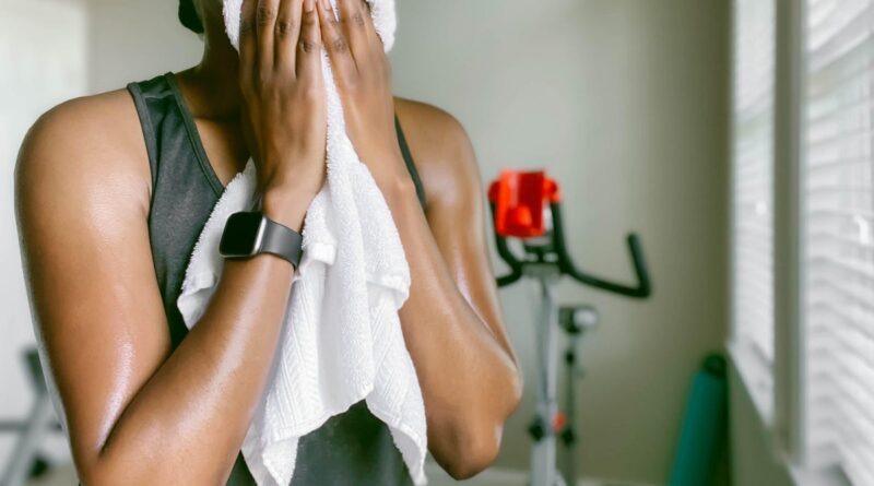 a woman wearing a towel over her face